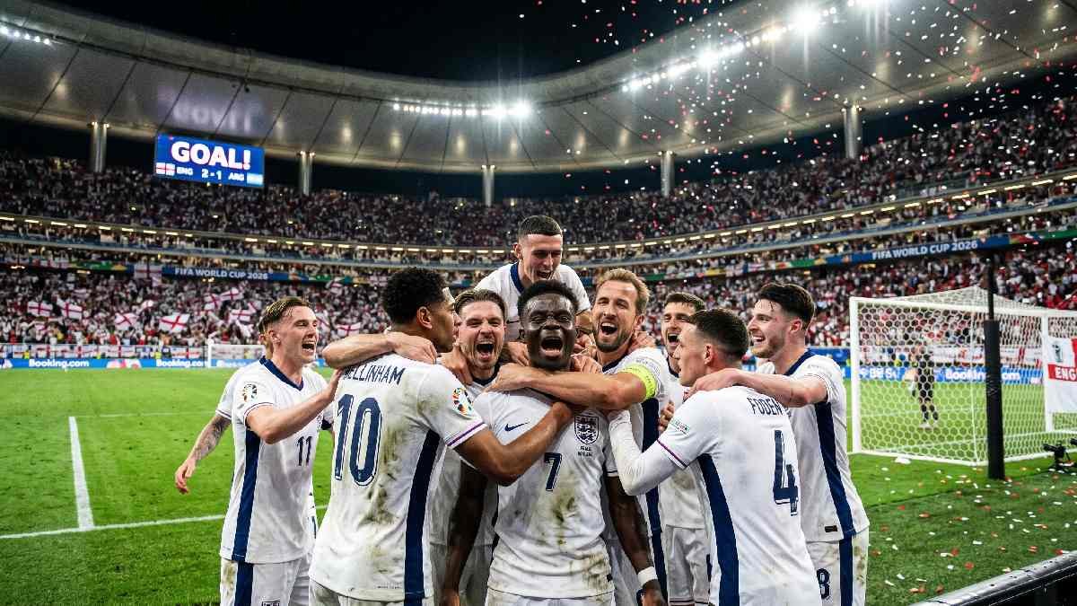 England players celebrating dramatic knockout stage goal at FIFA World Cup 2026 with packed stadium and St George's Cross flags.