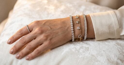 How to choose the perfect diamond bracelet for any occasion featuring sparkling tennis charm and bangle styles on wrist.