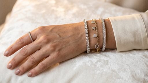 How to choose the perfect diamond bracelet for any occasion featuring sparkling tennis charm and bangle styles on wrist.