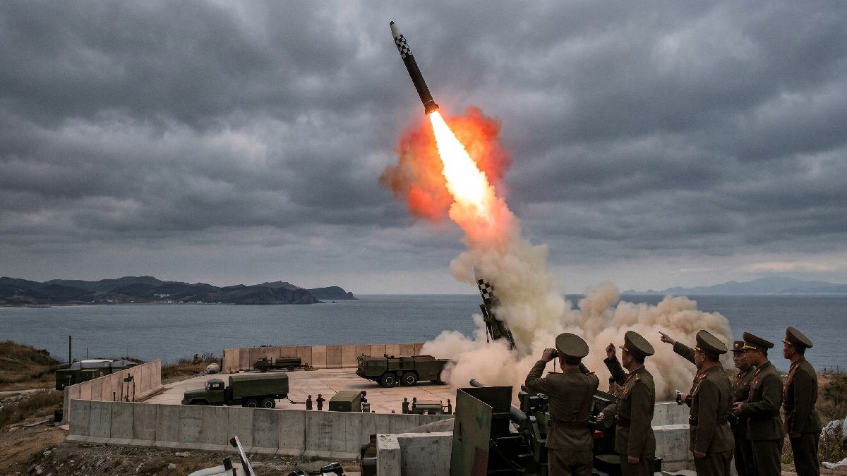North Korean ballistic missile launching into dark sky representing North Korea missile threats and rising Asian tensions in 2026.