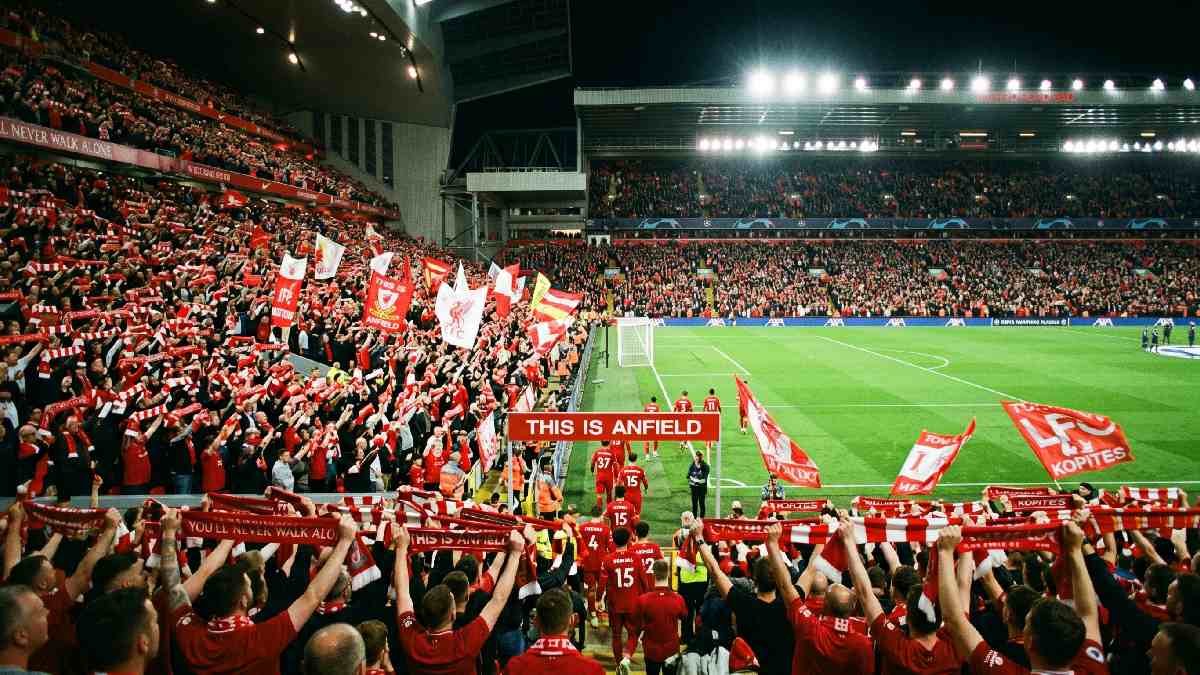 Sold-out Anfield stadium packed with Liverpool FC fans in red, showing why tickets are hard to get.